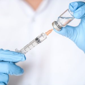Doctor,,Nurse,,Scientist,Hand,In,Blue,Gloves,Holding,Flu,,Measles,